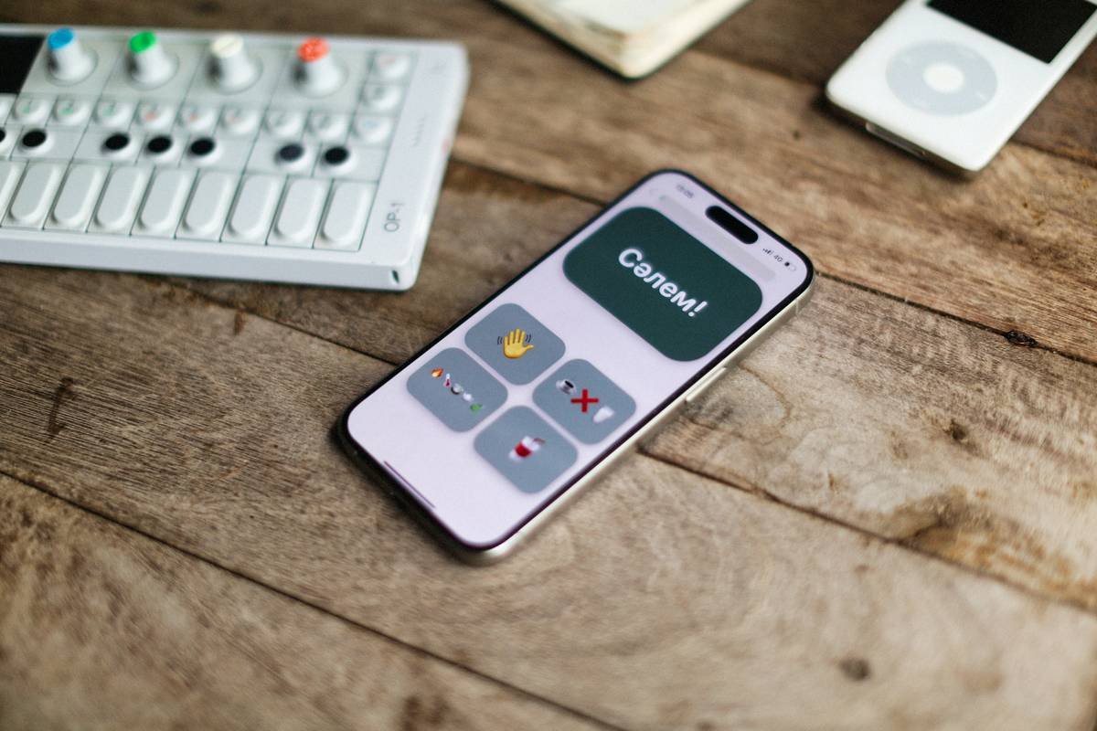 A smartphone with an interface lays on wood.